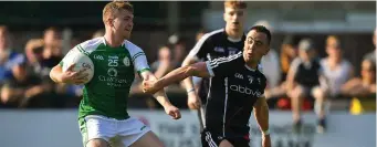  ??  ?? Fergal McMahon of London in action against Neil Ewing of Sligo. Pic: Sportsfile.