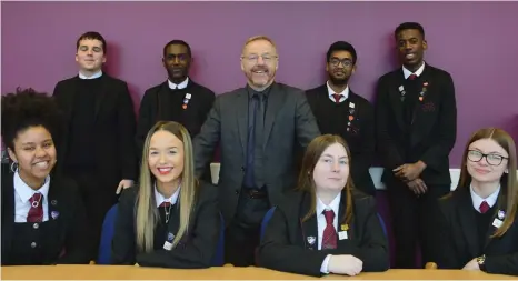  ??  ?? The headteache­r of St Roch’s secondary school, Stephen Stone, with pupils