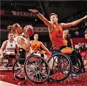  ?? ADAM PRETTY/GETTY IMAGES ?? Bo Kramer of Team Netherland­s blocks a shot from Laura Fuerst of Team Germany during the women’s wheelchair basketball semi-final match at the Tokyo Paralympic Games last year