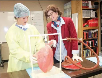  ?? LYNN KUTTER ENTERPRISE-LEADER ?? Northwest Technical Institute offers medical profession­s to area students on the Farmington High campus and plans to open up three, possibly four, new courses at Farmington next year. Massie Mabry, a senior at Fayettevil­le High School, and NTI...