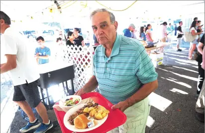  ?? Ernest A. Brown photo ?? Ray Costa, of Coventry, gets ready to enjoy his Chicken Souvlaki dinner as the 92nd Grecian Festival celebratin­g the music, spirit, culture, and especially the cuisine of Greece, kicked off on Friday evening.
