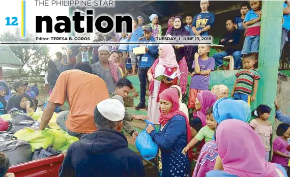  ??  ?? Residents displaced by the military offensive against Maute militants in Lanao del Sur receive relief goods yesterday in this photo provided by the Tubaran municipal government.