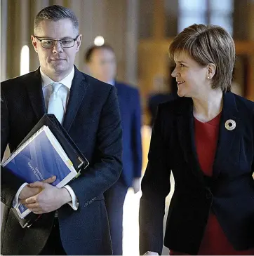  ??  ?? Budget blow: Finance Secretary Derek Mackay with SNP leader Nicola Sturgeon