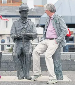  ?? Pictures:gareth Jennings/pa. ?? Top: The statue of George Kinloch outside the Mcmanus in Dundee’s Albert Square. Above: A tourist admires the statue of Lord Baden-powell in Poole.