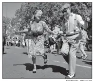  ?? AP/MICHEL SPINGLER ?? in World War II-era clothes dance Sunday in Paris.