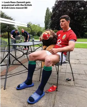  ??  ?? > Louis Rees-Zammit gets acquainted with the British & Irish Lions mascot Bil