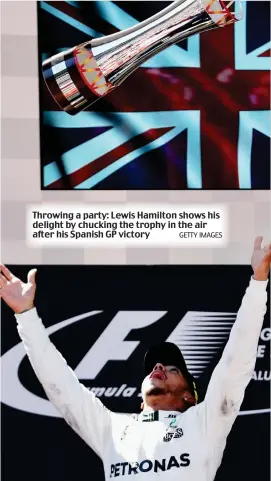  ?? GETTY IMAGES ?? Throwing a party: Lewis Hamilton shows his delight by chucking the trophy in the air after his Spanish GP victory