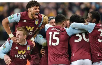  ?? EPA ?? Tight-knit: Villa celebrate together after scoring and have a chance to stay up tomorrow