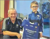  ?? ?? This fab picture is of Danny Aherne who won the support our county and dress up in the red and white colours. Danny was presented with his prize by his granduncle, Andrew Monaghan.