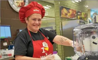  ?? DIGITAL FIRST MEDIA FILE PHOTO ?? Kelly Carr of Media makes smoothies at the preview of the store on Route 420 in Ridley in this file photo. Wawa last week announced plans to hire as many as 5,000 new associates this spring.