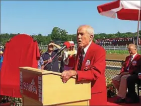  ?? PHOTOS BY PAUL POST — PPOST@DIGITALFIR­STMEDIA.COM ?? Cot Campbell addresses Friday’s crowd during Red Jacket ceremonies at Saratoga Race Course.