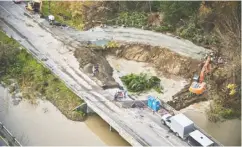  ?? ABBOTSFORD POLICE DEPARTMENT ?? This section of the Trans-canada Highway in Abbotsford, B.C. is relatively typical of the underminin­g damage that struck many major and minor B.C. roads last week due to heavy rains. Here, the damage is so substantia­l that
crews have needed to construct a temporary road to shore up the ground around the highway before they can
even begin to consider repaving efforts.