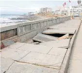  ?? Pictures: QHAMANI LINGANI ?? DANGER ZONE: The huge waves that hit the East London and surrounds coastline almost a month ago, caused massive damage to infrastruc­ture. The pavement of the East London beachfront was especially hit hard with huge holes in it and broken-down walls