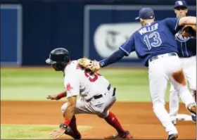  ?? WILL VRAGOVIC — TAMPA BAY TIMES VIA AP ?? Rays shortstop Brad Miller tags Chris Young during a rundown in the sixth inning on Thursday.