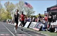  ?? PAUL DICICCO — FOR THE NEWS-HERALD ?? University’s Michael Beros crosses the finish line May 1 during the Mentor Cardinal Relays.