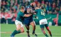  ?? AFP ?? France’s Uini Atonio is tackled by South Africa hooker Malcom Marx and wing Raymon Rhule. —