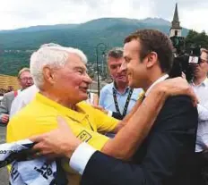  ?? AFP ?? French President Emmanuel Macron (right) speaks with former French cyclist Raymond Poulidor.