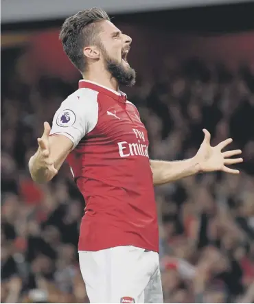  ??  ?? Arsenal striker Olivier Giroud celebrates scoring his side’s dramatic winning goal last night.