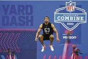  ?? AP ?? Baylor defensive back JT Woods prepares to run the 40-yard dash at the NFL scouting combine, which will remain in Indianapol­is for the next two years.