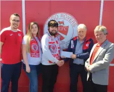  ??  ?? Katie &amp; Regan Wallace receiving a cheque of €14,300 from Frank Beirne &amp; Shane Crossan of Sligo Rovers. Also pictured is ticket seller Pat Wallace.