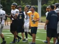  ?? PATRICK HOPKINS — THE NEWS-HERALD ?? Euclid coach Jeff Rotsky watches his team during a scrimmage against Cardinal Mooney on Aug. 11. The Panthers played on their new turf at Sparky DiBiasio Stadium for the first time.