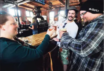  ?? Brian A. Pounds / Hearst Connecticu­t Media ?? Customers enjoy some beer at Bad Sons in Derby.