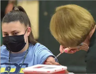  ?? PETE BANNAN - MEDIANEWS GROUP ?? Jenna Bell gets the Pfizer COVID vaccine at Ridley High School Monday afternoon.