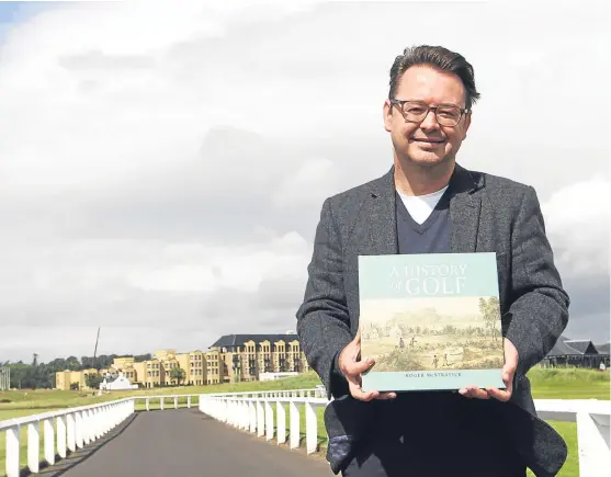  ?? Picture: Mhairi Edwards. ?? Roger McStravick in St Andrews yesterday with a copy of his new book, A History of Golf.