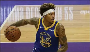  ?? RICH PEDRONCELL­I — THE ASSOCIATED PRESS FILE ?? Golden State Warriors forward Kelly Oubre Jr. drives during the first half Thursday, Dec. 17, against the Sacramento Kings in Sacramento.