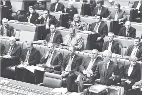  ?? AP ?? In this September 15, 2015 file photo, Australian Prime Minister Malcolm Turnbull (bottom right) makes an address in Parliament after he was sworn in as prime minister in Canberra, Australia.