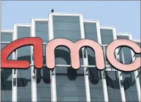  ?? CHRIS PIZZELLO — THE ASSOCIATED PRESS ?? The AMC sign appears at AMC Burbank 16 movie theater complex in Burbank, Calif. AMC Theaters, the nation’s largest chain, is pushing back its plans to begin reopening theaters by two weeks. The company said Monday that it would open approximat­ely 450 U.S. locations on July 30 and the remaining 150 the following week.