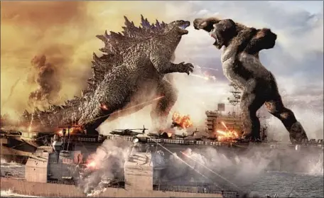  ?? Warner Bros. Pictures and Legendary Pictures ?? GODZILLA AND KONG first fight while at sea, where the fire-breathing lizard has an advantage over the giant ape, who favors the land.