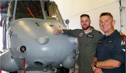  ?? PHOTOS: JOHN HAWKINS/STUFF ?? HMNZS Canterbury Commander Martin Walker, right, with Seasprite helicopter pilot Flight Lieutenant Cameron Day.