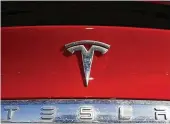  ?? DAVID ZALUBOWSKI / ASSOCIATED PRESS ?? The government’s auto safety agency is investigat­ing whether a recall in 2023 of Tesla’s Autopilot driving system did enough to make sure drivers pay attention to the road.