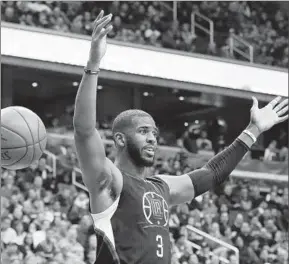  ?? Carolyn Kaster Associated Press ?? IT DOESN’T HAPPEN OFTEN, so when Chris Paul dunks, he feels a celebratio­n is in order. The Clippers point guard did it twice Monday, his first two dunks of the season.