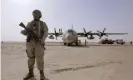  ?? Images ?? A Saudi soldier stands near an air force cargo plane at an airfield in Yemen’s central province of Marib. Photograph: Abdullah AlQadry/AFP/Getty