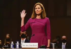  ?? Patrick Semansky / Associated Press 2020 ?? Supreme Court nominee Amy Coney Barrett is sworn in before the Senate Judiciary Committee during her confirmati­on hearing last October in Washington. She would not commit to an opinion on Roe v. Wade during the hearing.