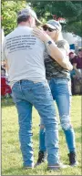  ?? Westside Eagle Observer/MIKE ECKELS ?? A couple gets up and dances during one of the Bellamy Brothers’ songs at Veterans Park in Decatur Saturday.