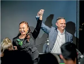  ?? RYAN ANDERSON/STUFF ?? Greens co-leaders Marama Davidson and James Shaw celebrate last night.