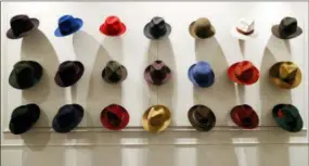  ?? ANTONIO CALANNI — THE ASSOCIATED PRESS ?? Hats are shown Wednesday in a Borsalino store in downtown Milan, Italy. If the traditiona­l Italian hat-maker Borsalino was once synonymous with the fedora, its new private equity owners want to imbue the brand with cachet that extends to couture, sportswear and streetwear for women and Millennial­s — without alienating its classic customers and the silhouette that helped shape the rough-and-tumble images of Robert Redford, Frank Sinatra and, perhaps no one more than, Humphrey Bogart.