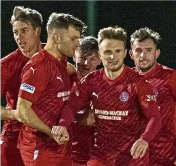  ?? ?? BRORA HERO: Tony Dingwall, second right, grabbed the only goal of the game.