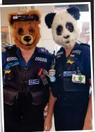  ??  ?? Bear necessity? Police support officers in masks