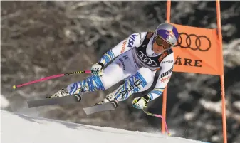  ?? Alain Grosclaude / Agence Zoom / Getty Images ?? In her final World Cup race, Lindsey Vonn speeds downhill in Are, Sweden, en route to a third-place finish. Vonn, 34, won 82 times during her career on the pro skiing circuit.