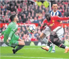  ??  ?? Near miss: Romelu Lukaku can’t squeeze ball past WBA’s Ben Foster