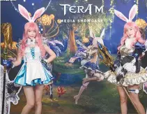  ??  ?? Models promote Netmarble Games and Bluehole Squall’s new mobile game “Tera M” during a media showcase at the GLAD hotel on Yeouido, Seoul, Friday.