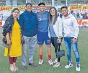  ?? BCCI ?? Suryakumar Yadav with his family after receiving his Test debut cap at the Vidarbha Cricket Associatio­n Stadium, Nagpur.