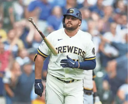  ?? JOHN FISHER/GETTY IMAGES ?? Rowdy Tellez flips his bat aside after belting a go-ahead three-run homer for the Brewers during the seventh inning against the Pirates on Wednesday.