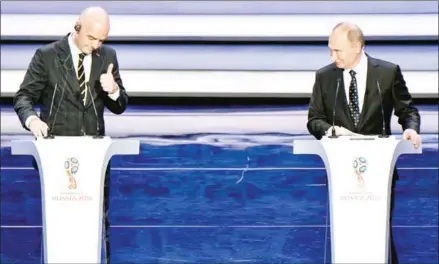  ?? MLADEN ANTONOV/AFP ?? FIFA president Gianni Infantino (left) and Russia’s President Vladimir Putin speak on stage ahead of the draw for the 2018 FIFA World Cup at the State Kremlin Palace in Moscow on Friday.