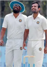  ?? — PTI ?? Baroda players Irfan Pathan (right) and Yusuf Pathan share a light moment during their Ranji Trophy Group ‘A’ match against Karnataka in Mysore on Saturday. Baroda pocketed three points on the basis of their first innings lead.