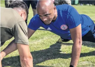  ?? Corporal Ben Beale ?? Goalkeepin­g coach Tony Warner is put through his paces